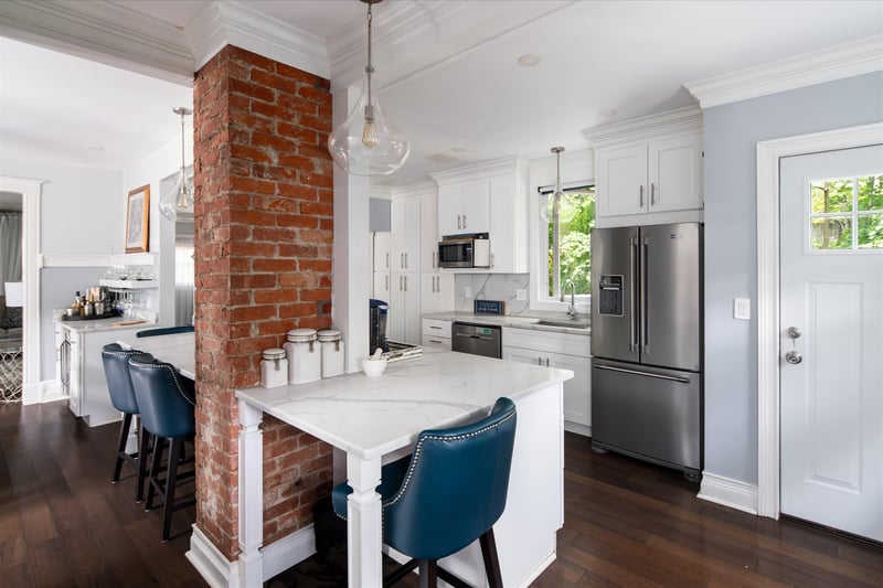 Kitchen door leads to back deck for easy summer entertaining.