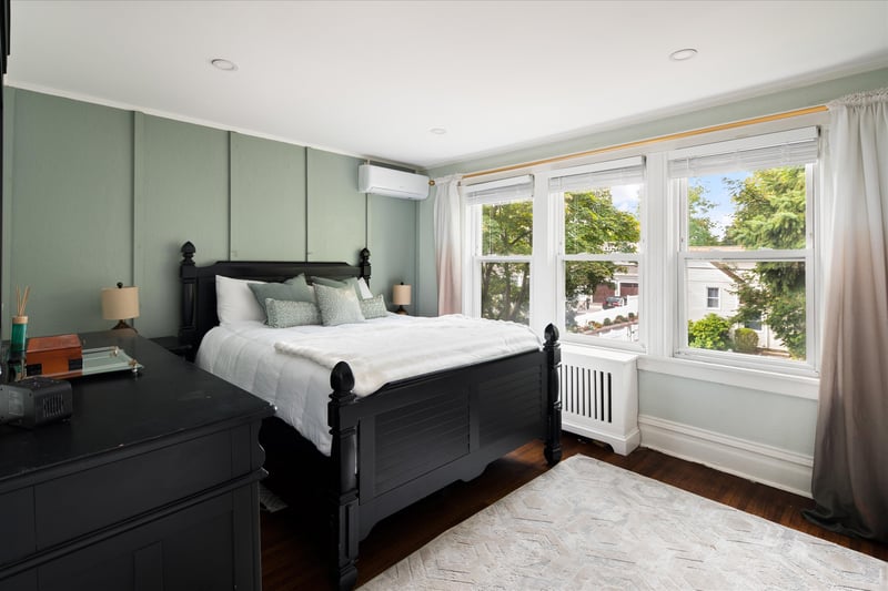 Primary bedroom with a wall of windows