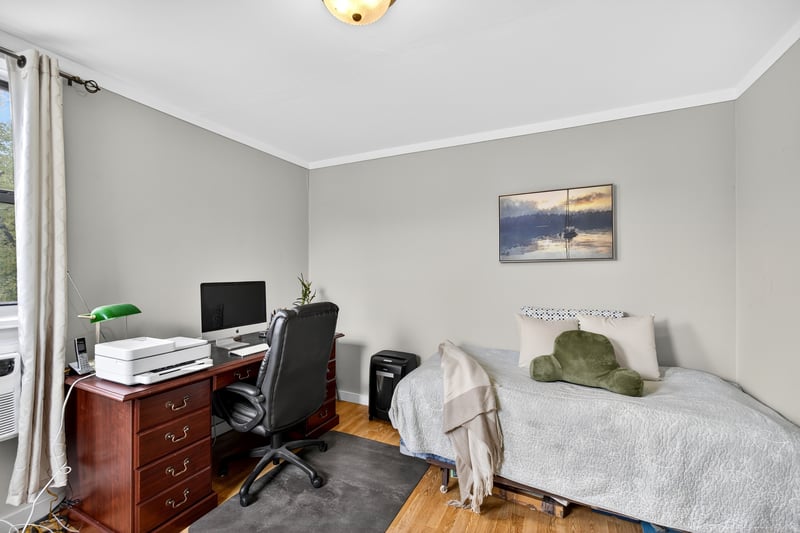 2nd Bedroom with wood finished floors and crown molding...