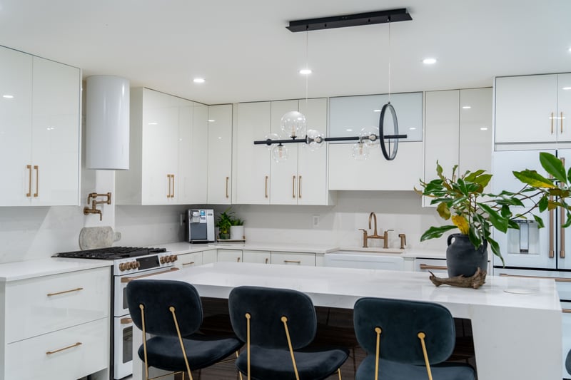 Kitchen with modern cabinets, white cabinets, white gas range, light stone counters, and recessed lighting...