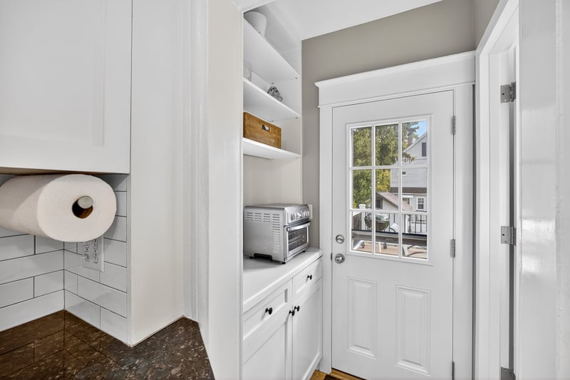 Butler pantry set-up with access to the back deck and yard from the kitchen