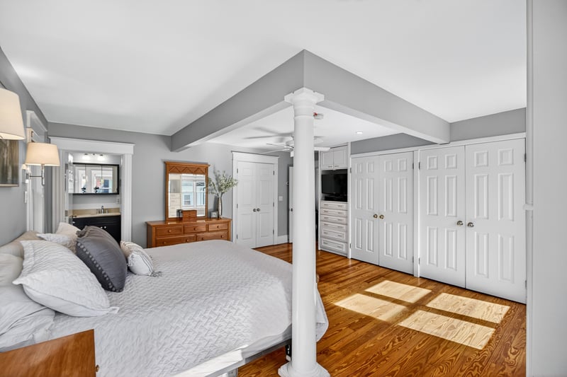 Primary bedroom offers ample storage and closets
