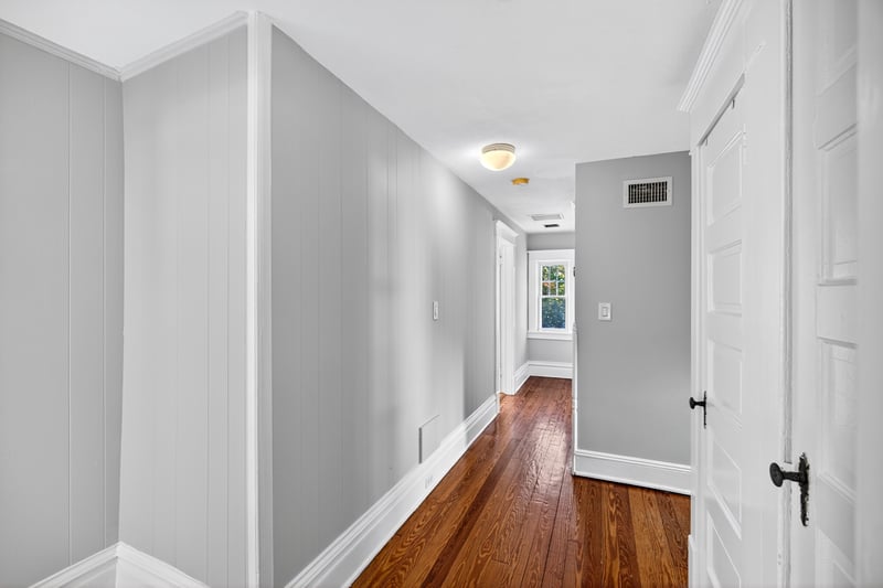 Upstairs landing that leads to a full hall bathroom, three bedrooms and walk-up attic
