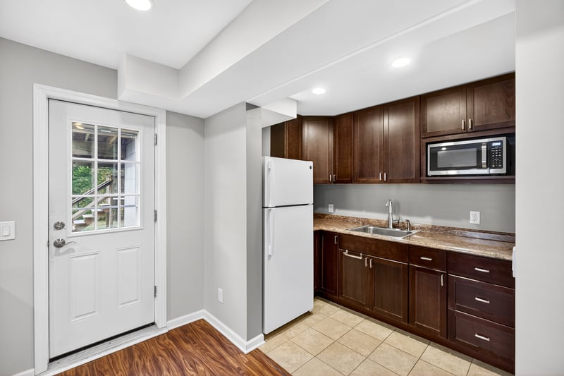 Wet bar in lowest level with access to the driveway and backyard