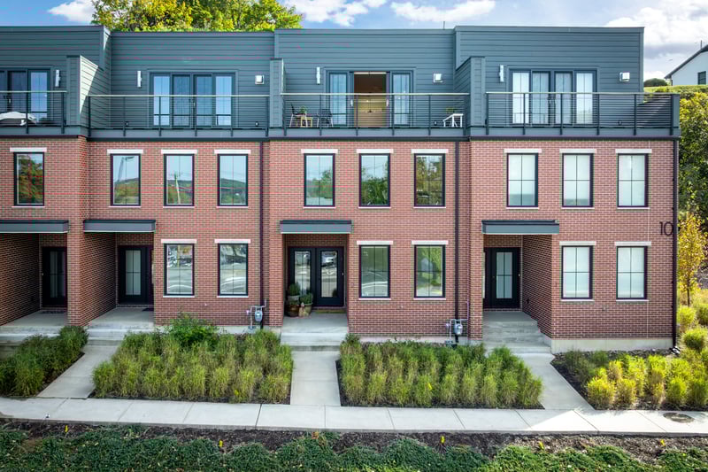 Unit #2 with large covered front entryway and rooftop terrace. The private garage entrance is in rear of building.