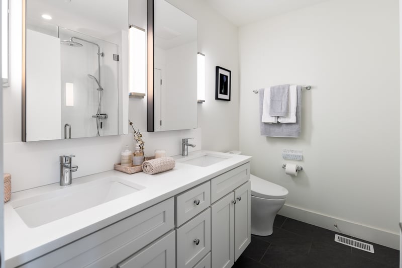 En-suite primary bathroom with Toto toilette, double vanity and large walk-in shower.