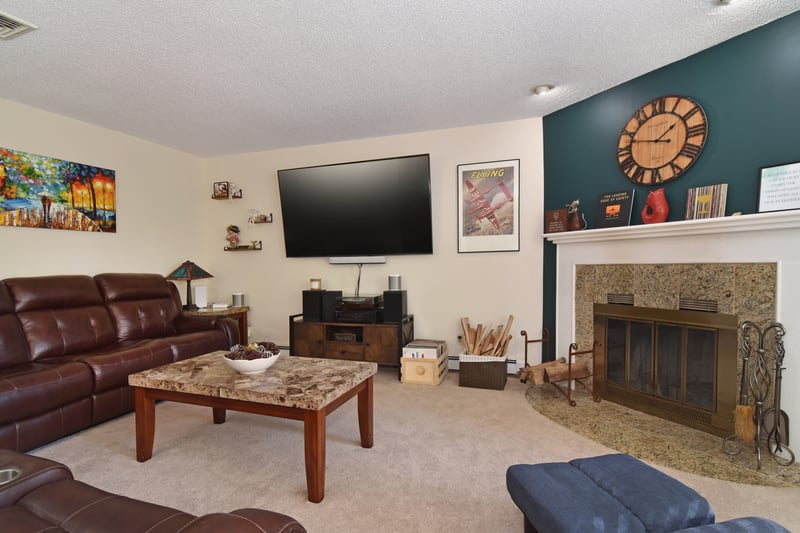 The living room offers an inviting setting that’s perfect for relaxing or entertaining guests.
