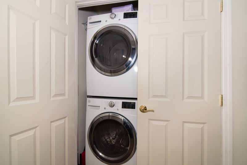 Say goodbye to shared laundry rooms with a dedicated washer/dryer space right across from the primary bedroom!