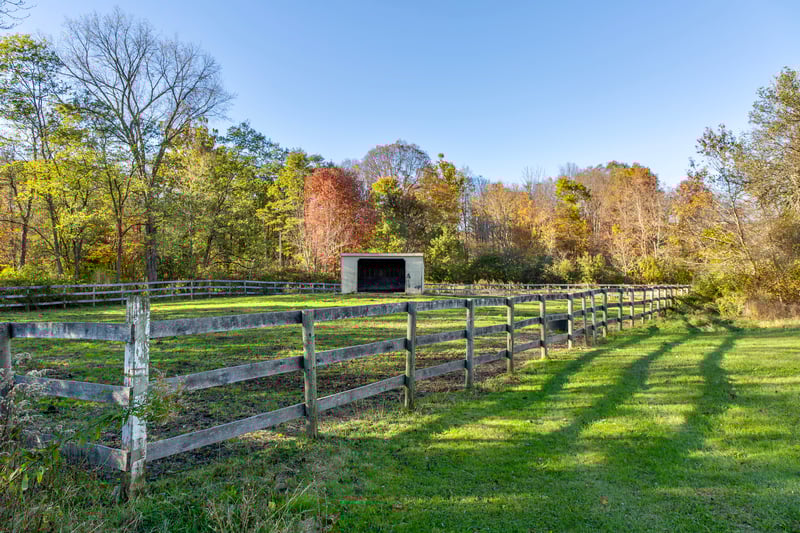 View of yard featuring an outdoor structure, a view of countryside, and a pole building