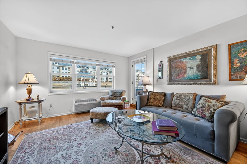 Living room with wood finished floors and an abundance of natural light...