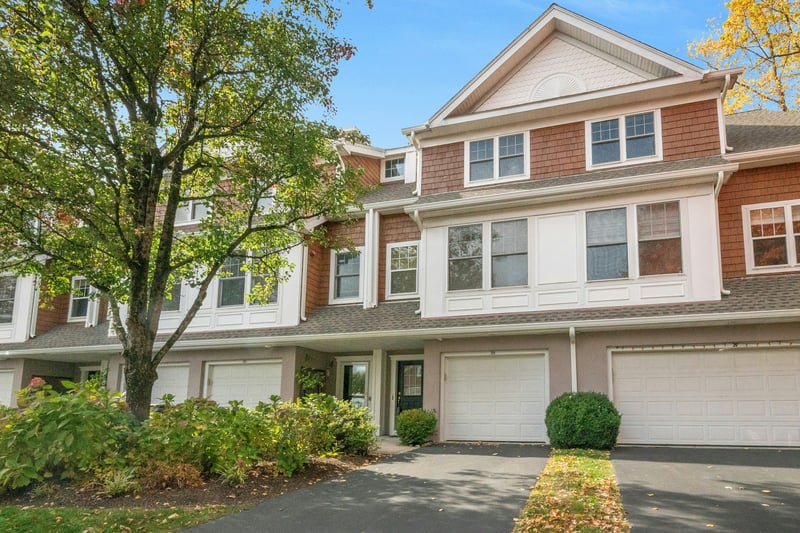 View of front of property featuring driveway and a garage