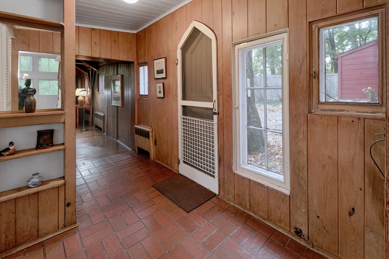 The entry hall, with the old door preserved. There are two small closets, too.