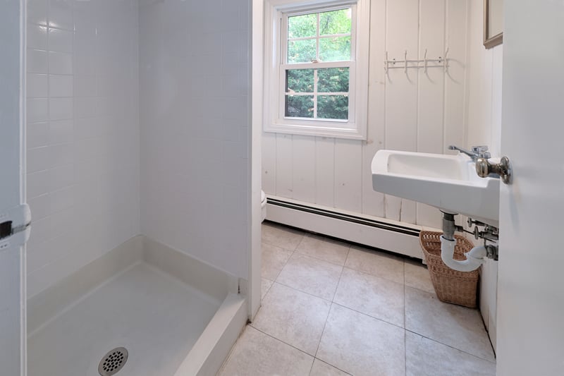 Lower level bathroom with a shower.