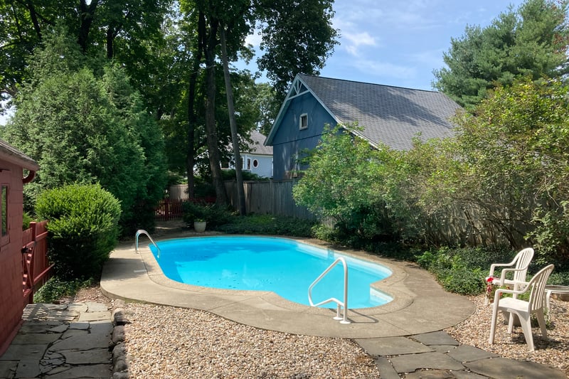 An elegant pool, tucked back, and private.