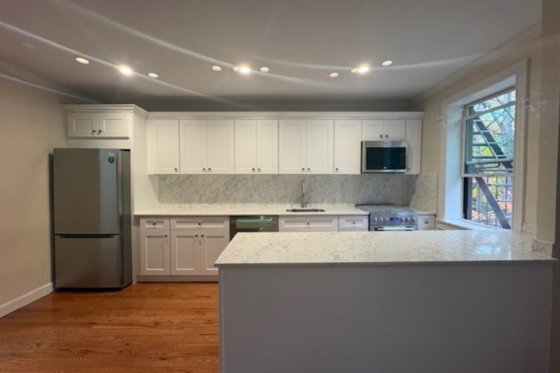 Kitchen featuring tasteful backsplash, stainless steel appliances including built in microwave