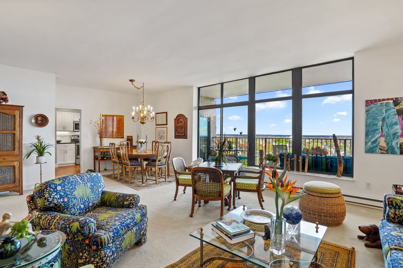 View of living room/dining room with sliders to balcony.