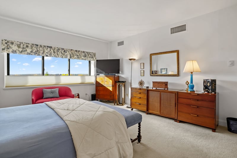 Beautiful tree top views can be enjoyed from the primary bedroom.