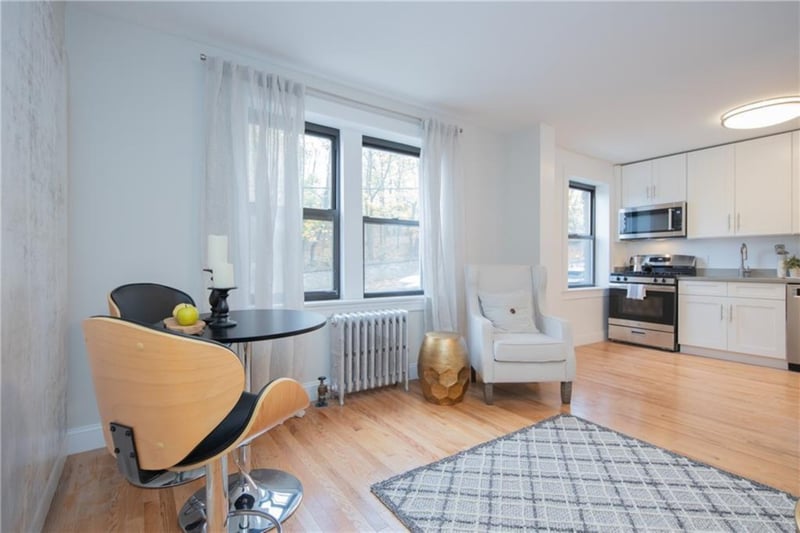 Sitting room featuring light hardwood / wood-style floors, sink, and radiator