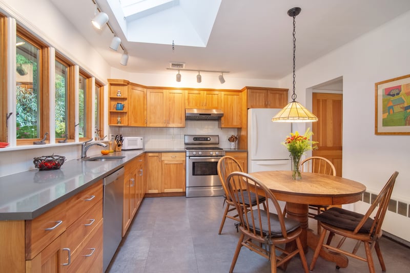 Expansive birch cabinetry offers abundant storage