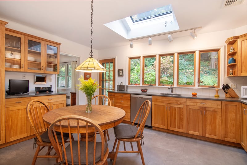 Eat-in-kitchen also features door to outdoor space where birds visit for morning bath