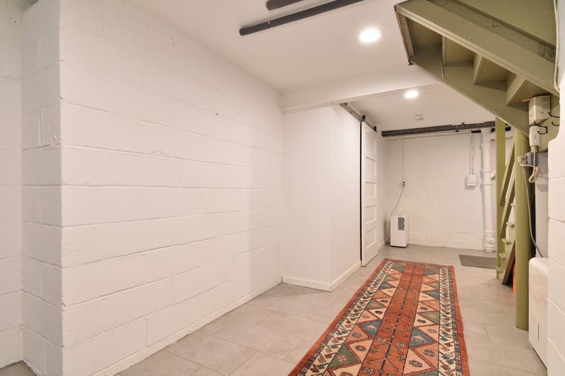 Bright hallway off garage offers easy access to home