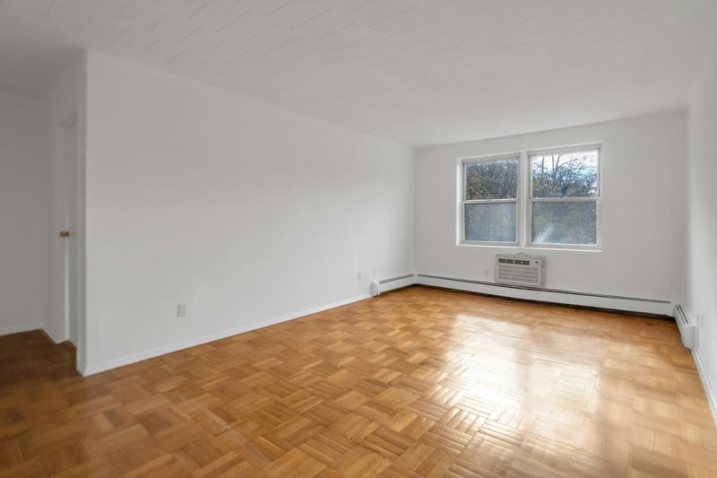 Another view of the living room with hardwood floors
