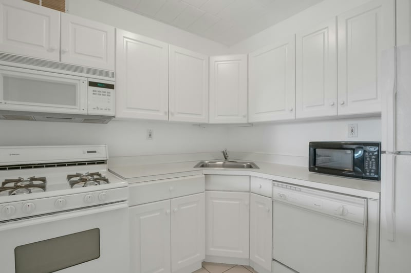 Plenty of cabinets and open view to the living room