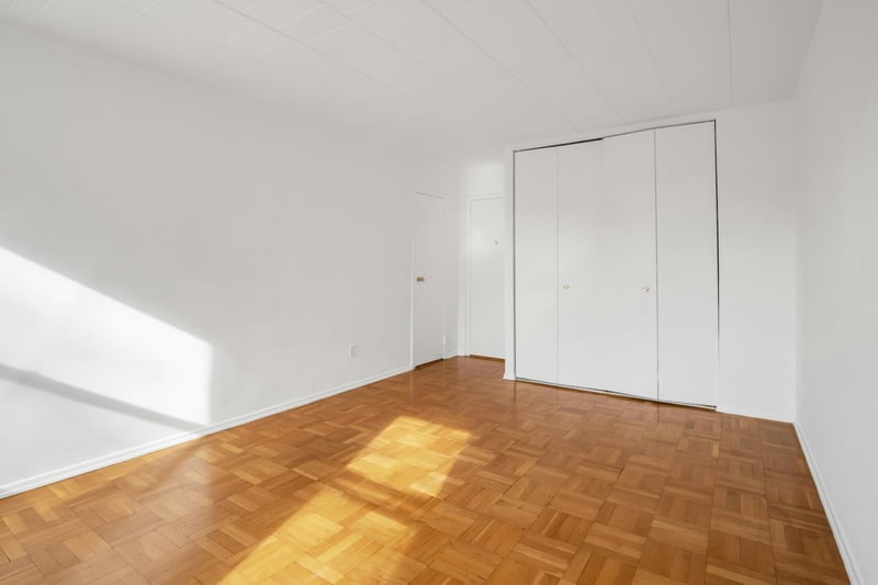 Another view of the bedroom with hardwood floors