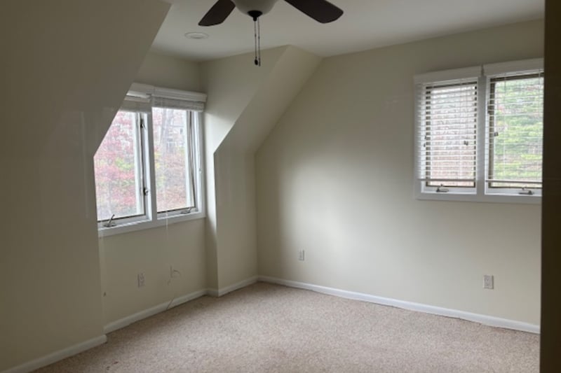 Second bedroom featuring carpet floors and a ceiling