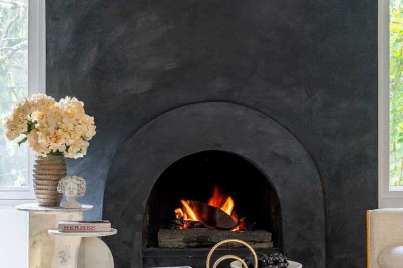 Detailed view of arched walkways and a warm lit fireplace