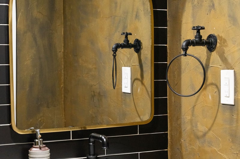 Bathroom with tasteful backsplash and tile walls