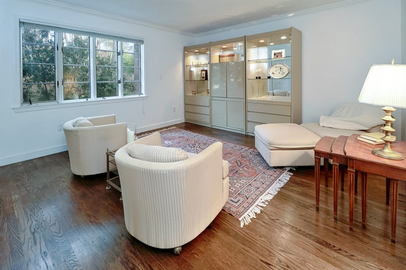 Second bedroom suite being used as a den, provides multiple windows with views of backyard.