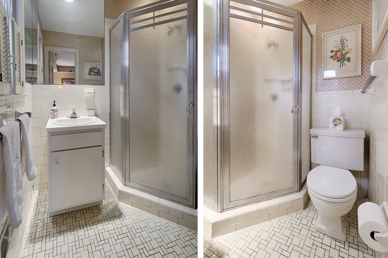 Full bath located off third bedroom suite features tile floor and stall shower.