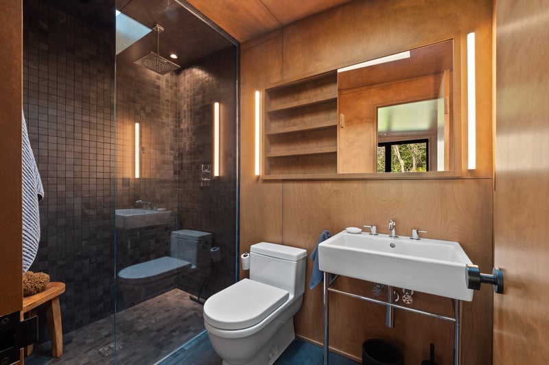 Full bathroom with toilet and a walk in shower