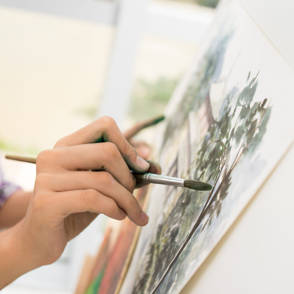 Close-up of painter doing a stroke