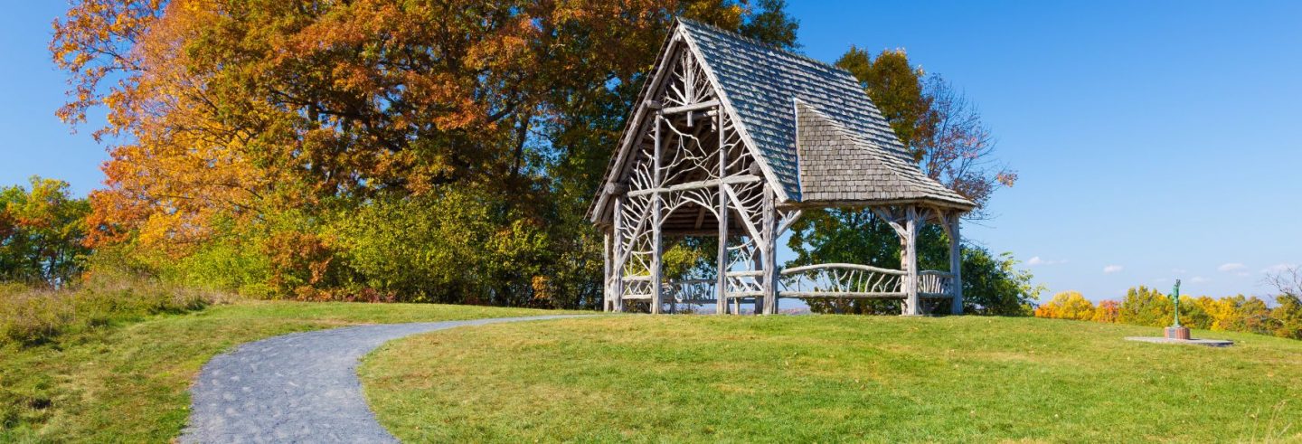 Landscape with Overlook Pavilion (Wooden Gazebo), Gravel Footpath, Trees in Autumn Colors (Foliage) and Vivid Blue Sky, Poets' Walk Park, Red Hook, Hudson Valley