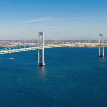 Claiborne Pell Newport Bridge on Narragansett Bay and town of Jamestown aerial view in summer, Jamestown on Conanicut Island, Rhode Island RI, USA.